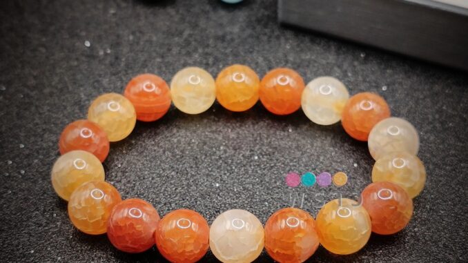 (พราว) หินเกล็ดมังกรส้ม Orange Crackle Agate (ขนาด 10 มม.) ผ่านพิธีปลุกเสกและบรรจุพุทธคุณเรียบร้อยแล้ว