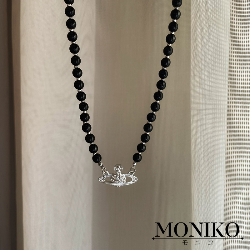 MONIKO สร้อยคอ ประดับลูกปัด ลายดาวเสาร์ สีดํา แฟชั่นสําหรับชาย และหญิง