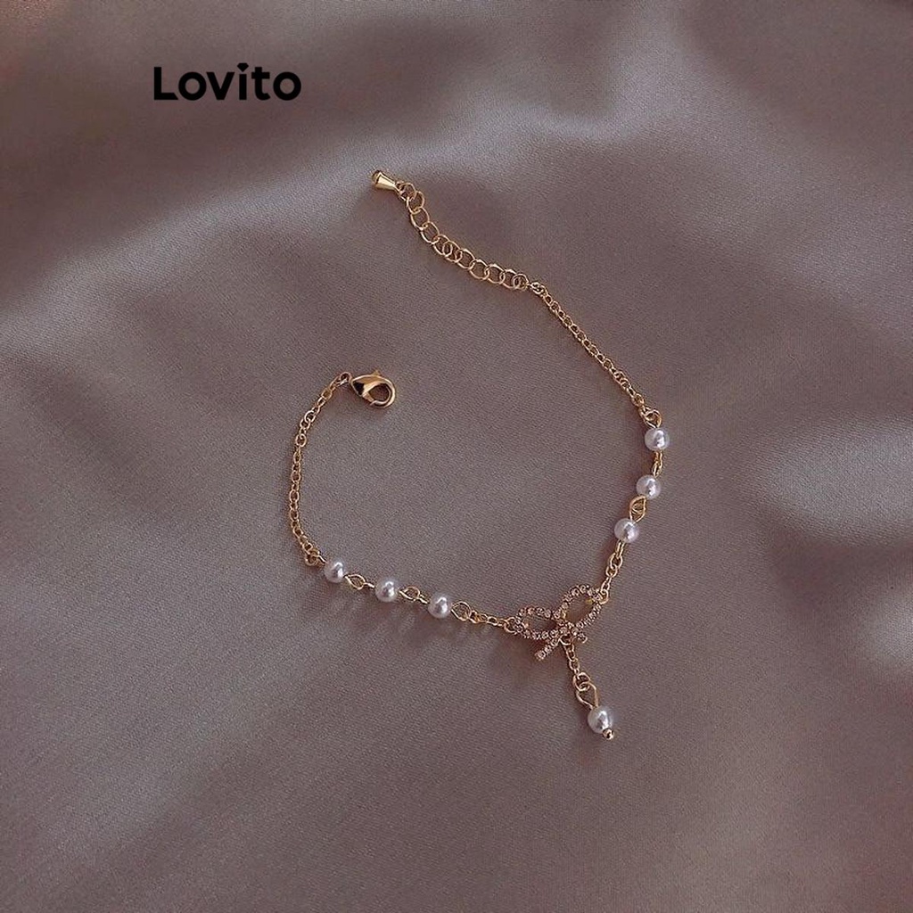 Lovito สร้อยข้อมือผู้หญิง แต่งพลอยเทียม ไข่มุก รูปโบว์ สีเรียบ สไตล์ลำลอง LFA09337