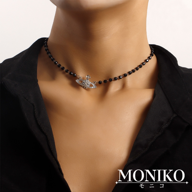 MONIKO สร้อยคอ ประดับลูกปัด ลายดาวเสาร์ สีดํา แฟชั่นสําหรับชาย และหญิง