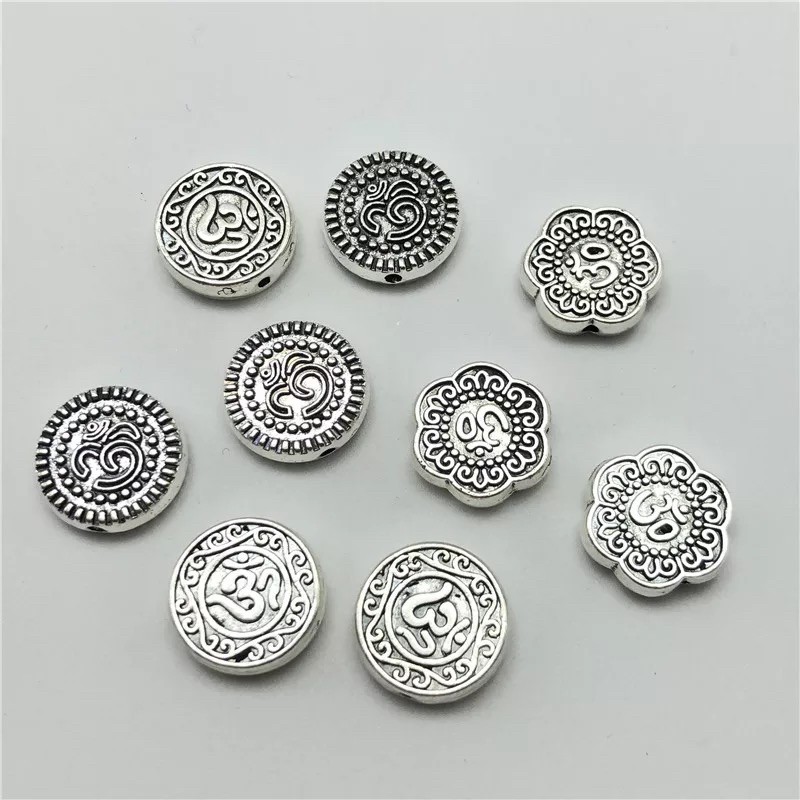 ลูกปัดเงินทิเบตแบนแกะลายโอม 15มม