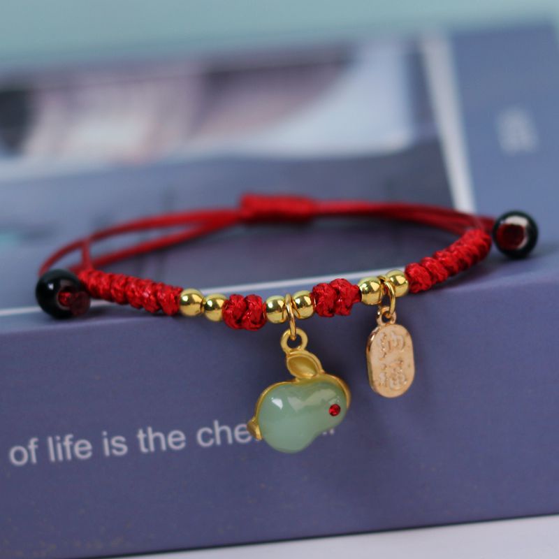 สร้อยข้อมือ เชือกถัก รูปกระต่าย สีแดง และสีดํา สามารถปรับได้ สําหรับผู้ชาย และผู้หญิง
