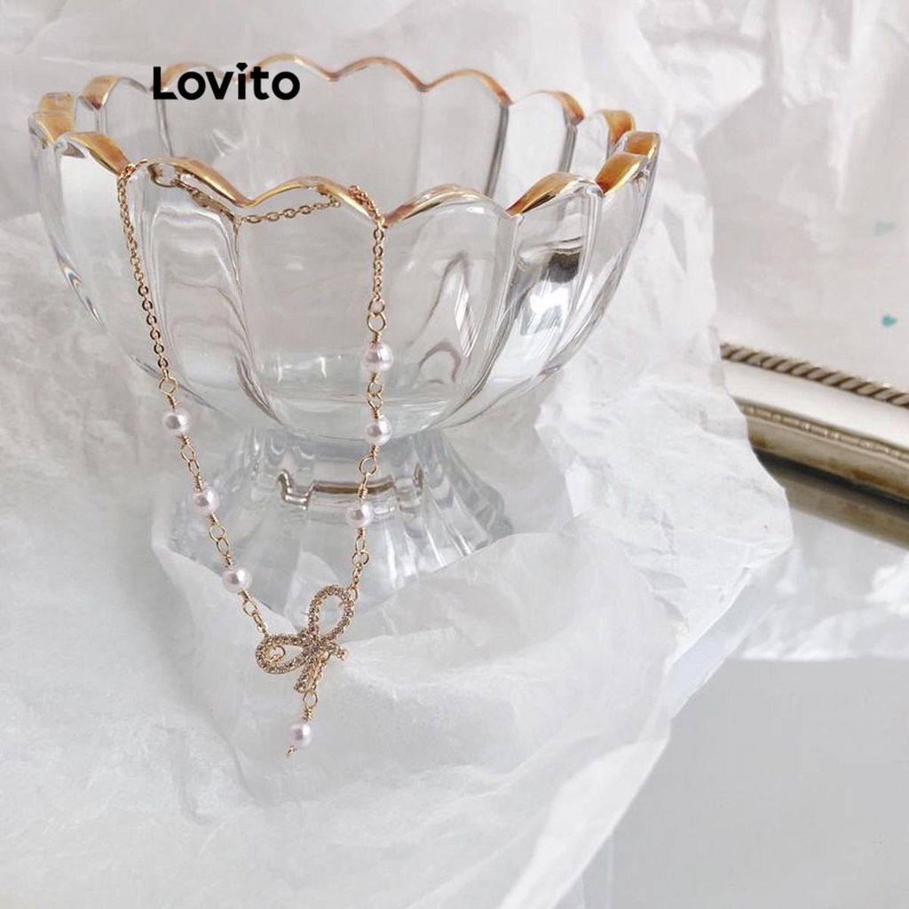 Lovito สร้อยข้อมือผู้หญิง แต่งพลอยเทียม ไข่มุก รูปโบว์ สีเรียบ สไตล์ลำลอง LFA09337