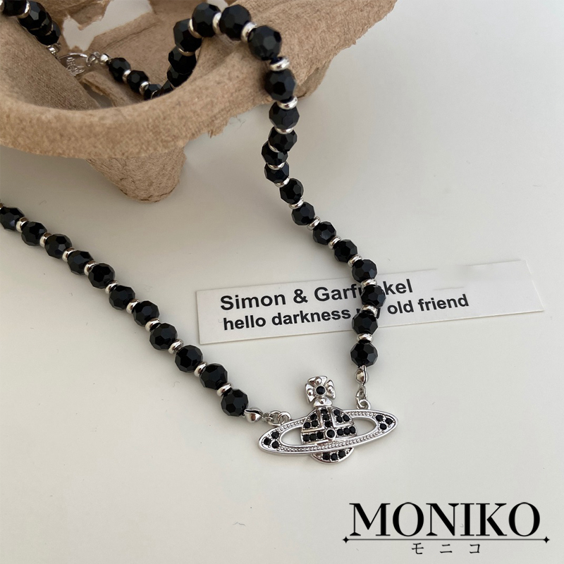 MONIKO สร้อยคอ ประดับลูกปัด ลายดาวเสาร์ สีดํา แฟชั่นสําหรับชาย และหญิง