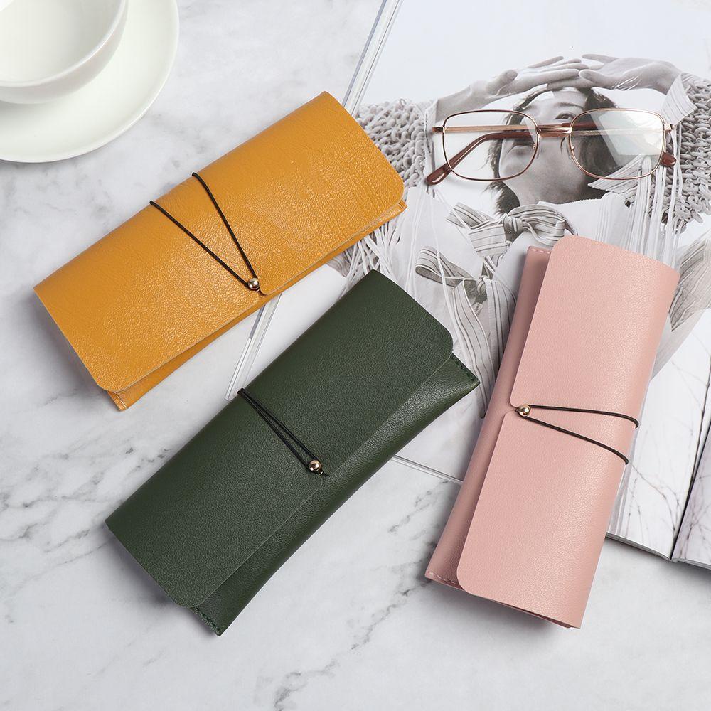 Melodygoods1 กระเป๋าใส่แว่นตา หัวเข็มขัดพับได้ แบบพกพา สีพื้น กระเป๋าเก็บแว่นตา