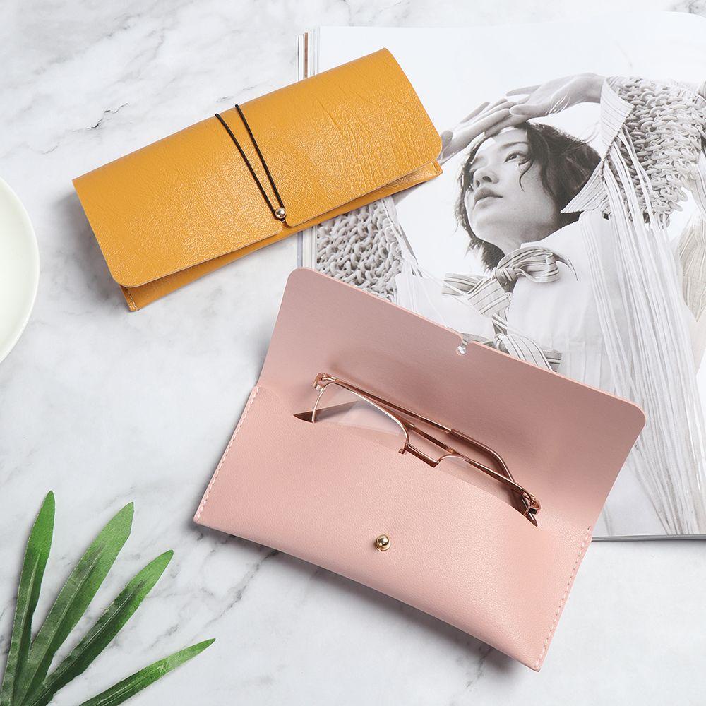 Melodygoods1 กระเป๋าใส่แว่นตา หัวเข็มขัดพับได้ แบบพกพา สีพื้น กระเป๋าเก็บแว่นตา