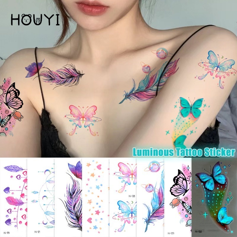 สติกเกอร์รอยสักชั่วคราว ลายขนนก ผีเสื้อเรืองแสง กันน้ํา สีฟ้า สําหรับตกแต่งร่างกาย